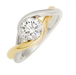 Brown Goldsmiths own Embrace ring is our Signature two tone of Platinum and 18k yellow gold with a diamond from The Brown Goldsmiths Signature Ring Collection