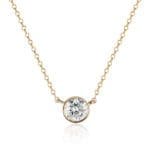 diamond bezel pendant necklace with a round brilliant diamond 0.70ct in 14k yellow gold attached to a cable chain that can be worn at both 16 & 18 inches long.
