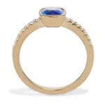 Cushion Cut Blue Sapphire and Diamond Ring. bezel set sapphire and bead set diamond sides. Side view