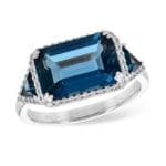 14kw Blue Topaz Ring East west emerald cut center and trilliant sides with diamond halos