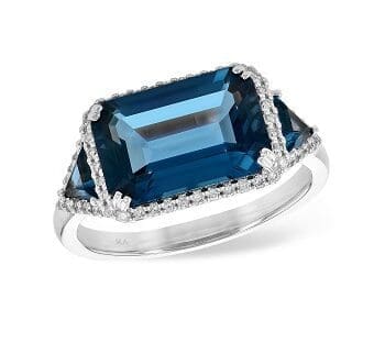 14kw Blue Topaz Ring East west emerald cut center and trilliant sides with diamond halos