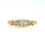 Tapered Diamond Channel band in yellow gold