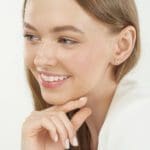Butterfly Stud earrings 14k yellow gold on a model