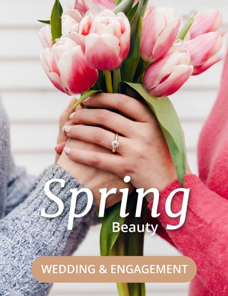 Couple holding tulip bouquet highlighting diamond ring engagement