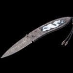 The Monarch Mist by William Henry B05 MIST inlaid with carved banded agate scales featuring a dragon.