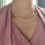 Diamond tennis necklace or Riviera Necklace in 14kY on model.