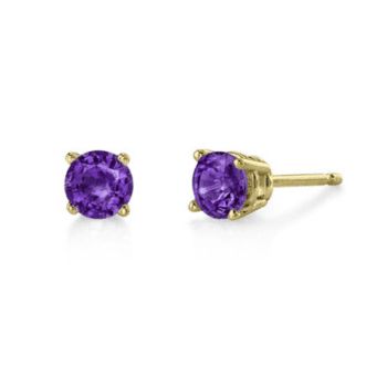 Close-up of 14K yellow gold round amethyst stud earrings with purple gems in four-prong settings.