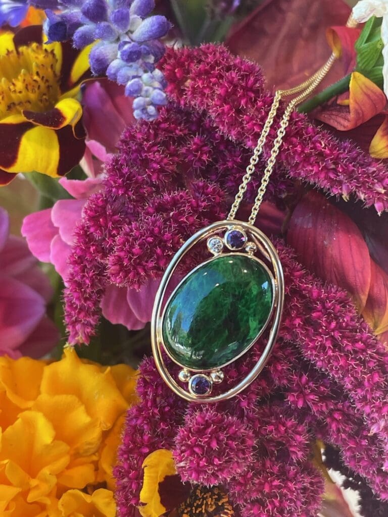 Purple sapphire, diamond and maw sit sit pendant