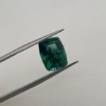 Maine Green Tourmaline in tweezers