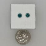 Teal Montana Sapphires with a dime for scale