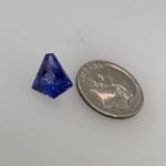 Tanzanite Kite loose with dime for scale 10.4mm X 9.5mm