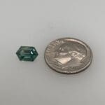 Teal Sapphire Hexagon 270-1282 loose with dime for scale