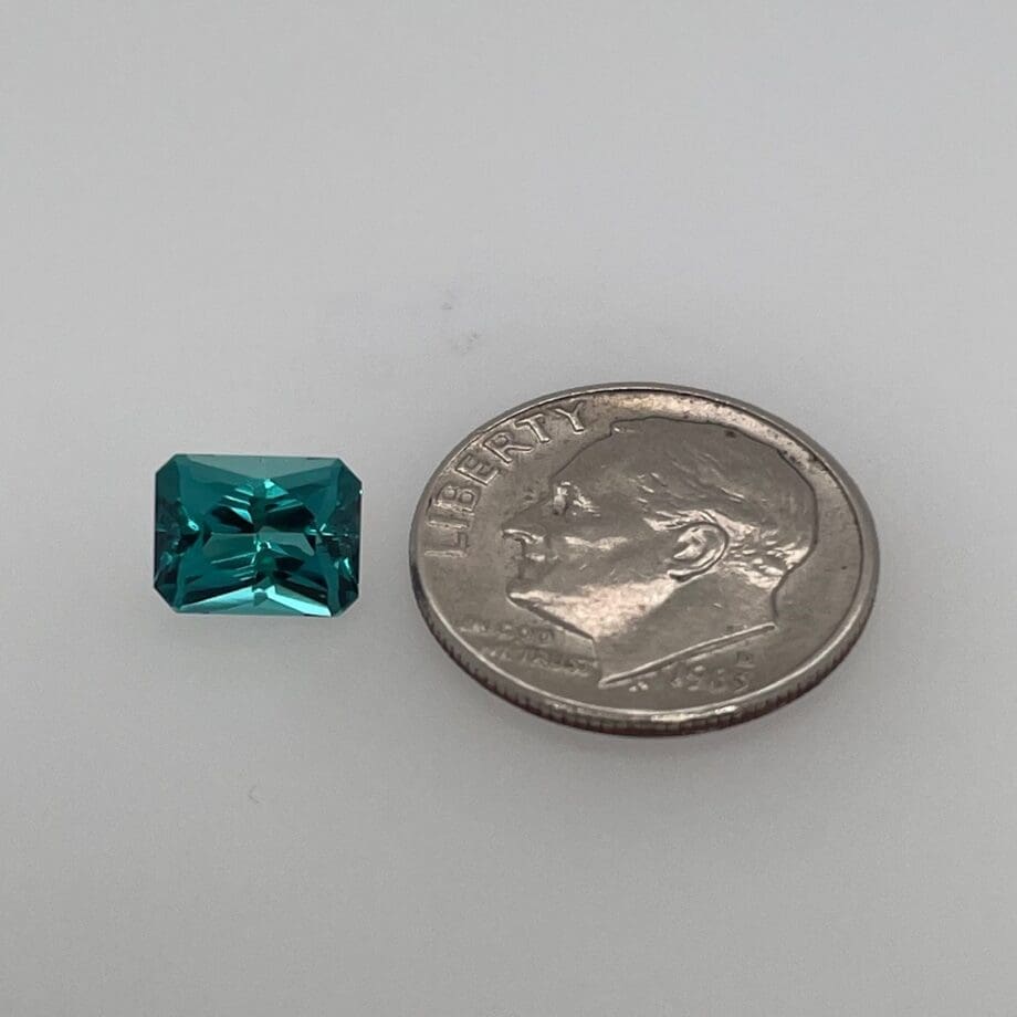 Blue Maine Tourmaline 1.62ct radiant cut loose with dime for scale