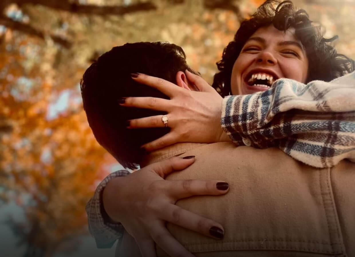 FALL_BG-HOMEPAGE-SLIDER-IMAGE-2025 Couple hugging in Fall