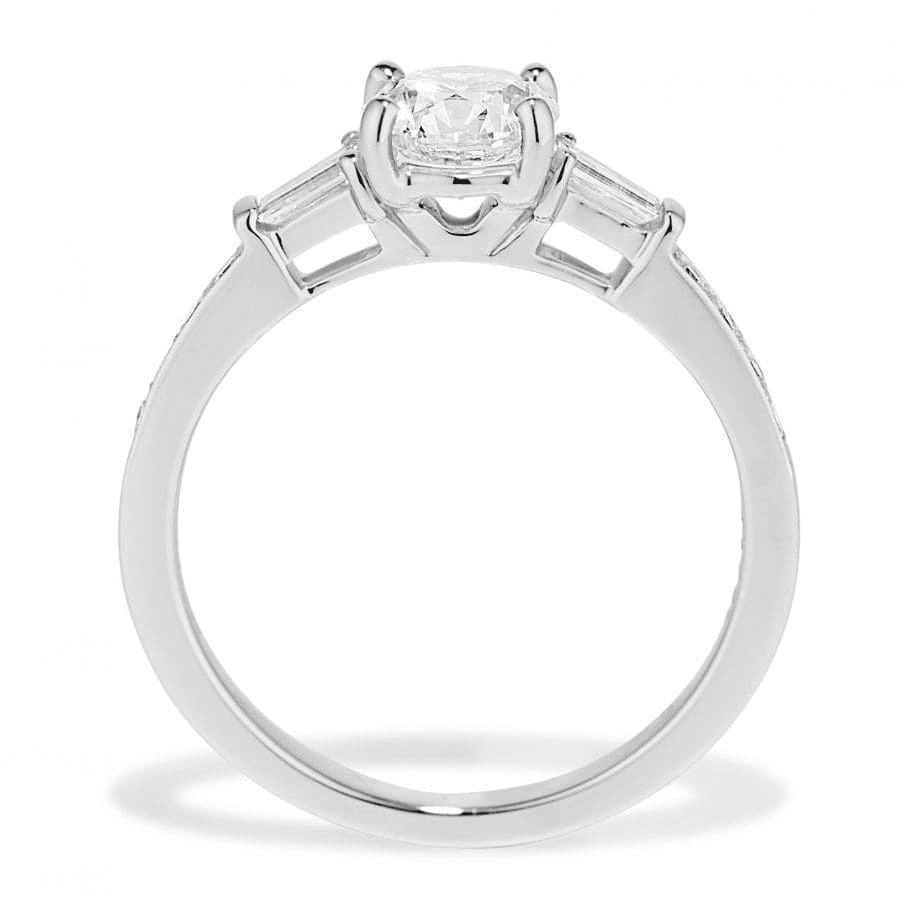 Platinum diamond engagement ring with round center and baguette side diamonds
