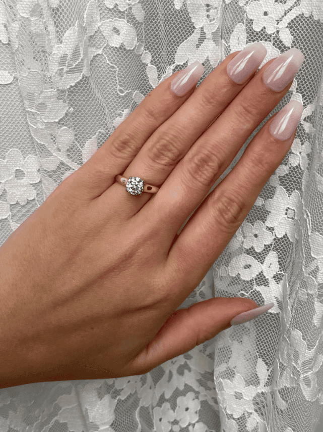 Modern solitaire ring with 1.50ct round diamond in 18K yellow gold and platinum setting
