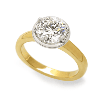 Round diamond engagement ring with 1.56ct center and 0.04ct side diamonds in 18K yellow gold and platinum, size 7