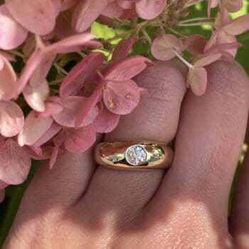 Dome ring in 14K yellow gold with flush set round diamonds