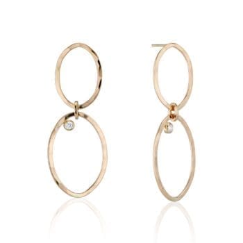 Multi link earrings in 14K yellow gold with bezel set round diamonds, displayed as post dangles
