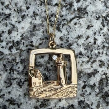 Nubble Light House pendant in 14K yellow gold with a round diamond accent