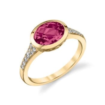 Contempo ring with magenta garnet center and oval side gems in 14K yellow gold