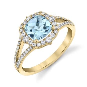 Aquamarine halo ring in 14K yellow gold with light blue center gem and square cushion cut diamond accents