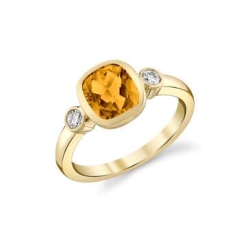 3 stone ring with an orange citrine center gemstone and elongated cushion cut side gems in 14K yellow gold