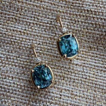 14K yellow gold earrings with teal blue zircon and elongated cushion cut side gems on French wires