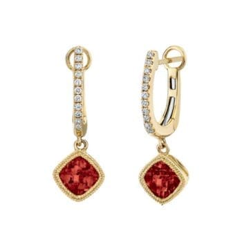 Huggie hoop earrings with red garnet center and square cushion cut accents in 14K yellow gold