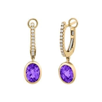 Pair of 14K yellow gold huggie hoops featuring purple chalcedony center gemstones and oval diamonds