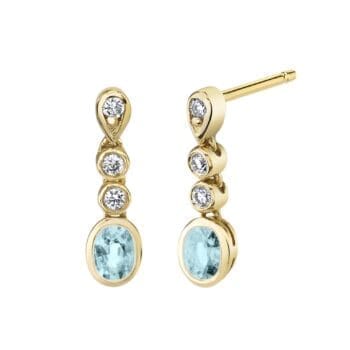 Light blue aquamarine oval post dangle earrings set in 14K yellow gold with diamond accents