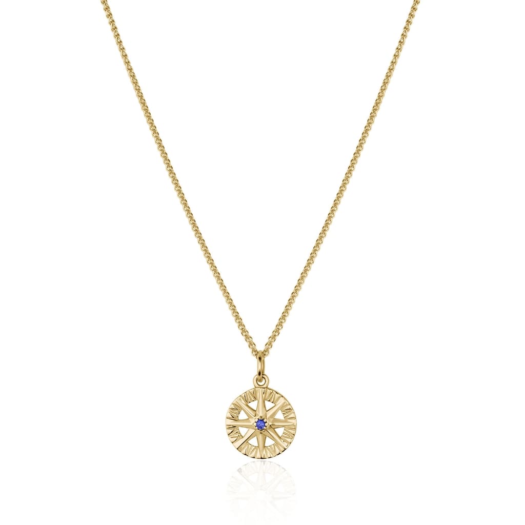 Compass Rose pendant in 14K yellow gold with central blue sapphire and round gemstone accents