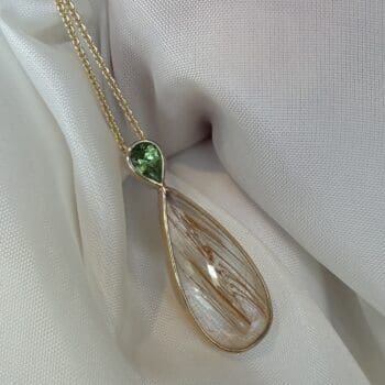 Drop pendant necklace in 14K yellow gold with rutilated quartz center and pear-shaped side gemstones