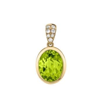Pendant necklace featuring lime green peridot drop and oval side diamonds set in 14K yellow gold