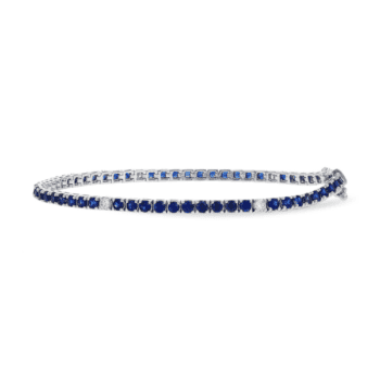 14K white gold tennis bracelet with a center sapphire and round side diamonds