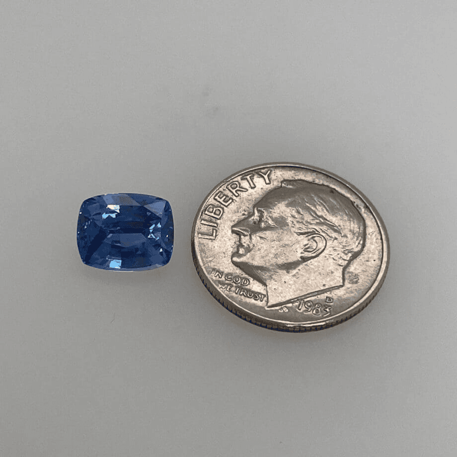 2.38 carat cushion cut vivid blue sapphire measuring 6.8 by 8.4 millimeters