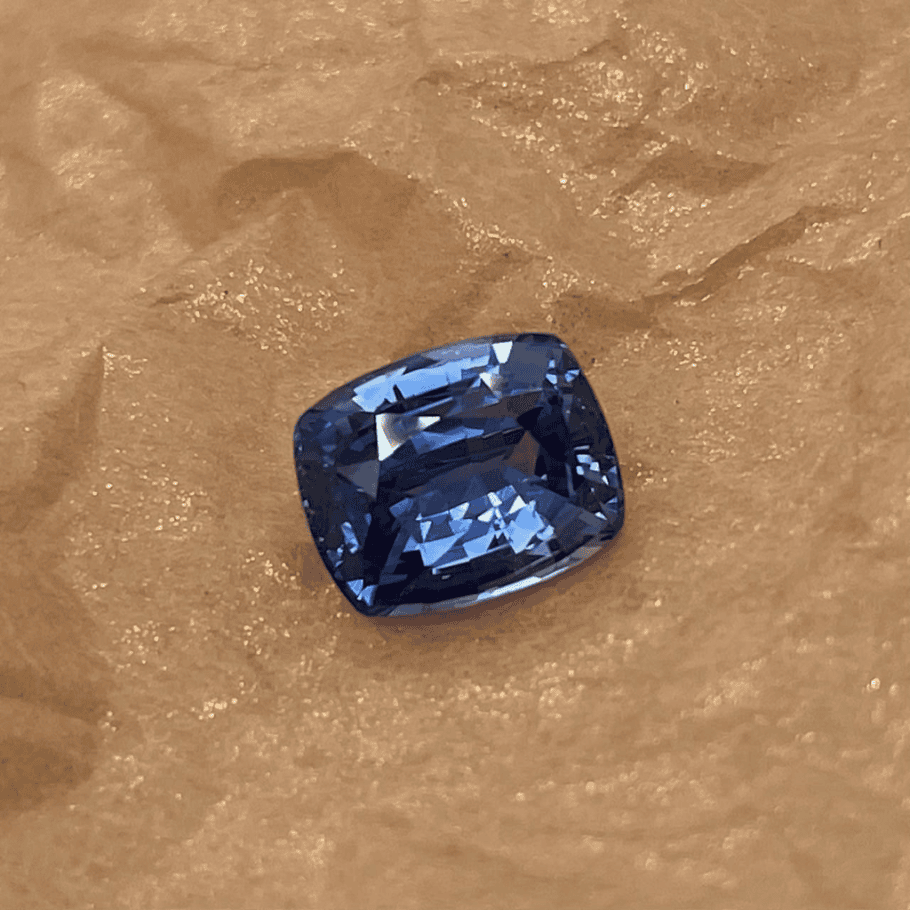2.38 carat cushion cut vivid blue sapphire measuring 6.8 by 8.4 millimeters