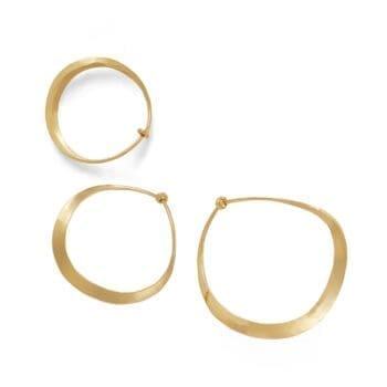 Curvy hoop earrings made of 14K yellow gold showing warm polished curves