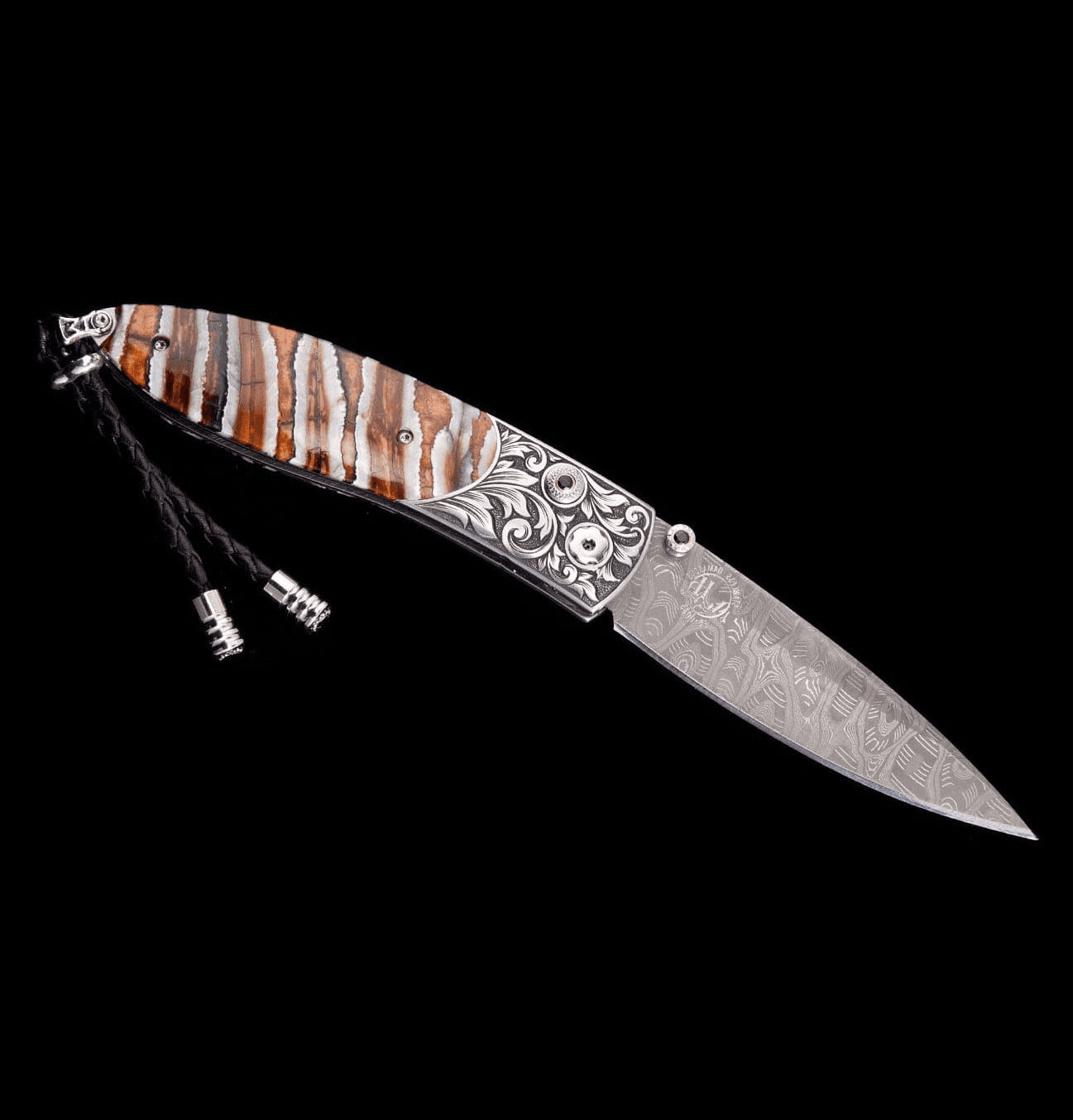 Jackson Monarch folding knife featuring hand-engraved stainless steel frame and fossil Woolly Mammoth tooth handle with damascus steel blade