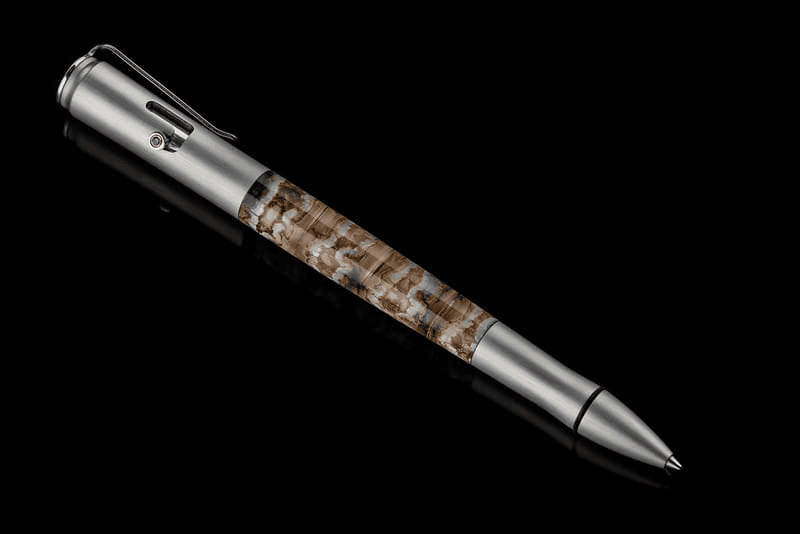 Bolt II Epic writing pen featuring fossil Woolly Mammoth tooth barrel and sapphire gemstone accents